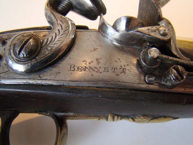 A pair of English flintlock brass barreled coaching pistols by John Bennett circa 1790 — image 10